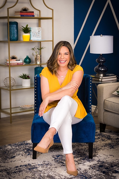 Diana Lowe seated casually, leadership coach and bestselling author